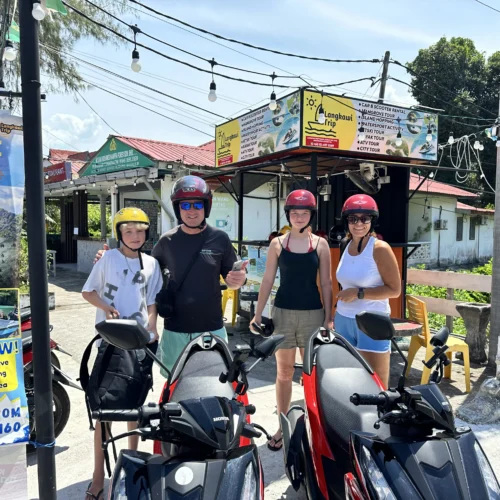 Family photo during scooter rental process in langkawi