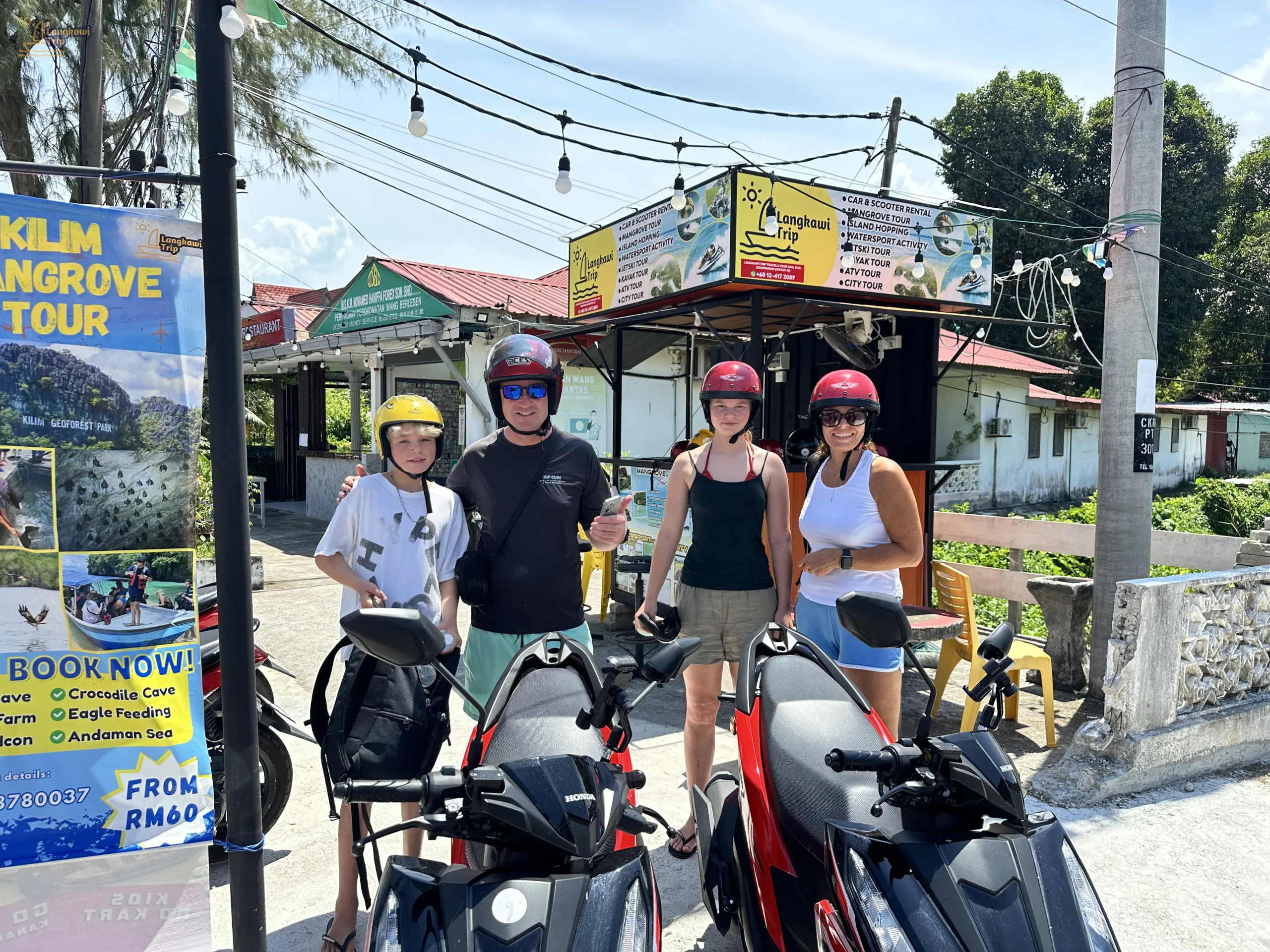 Family photo during scooter rental process in langkawi
